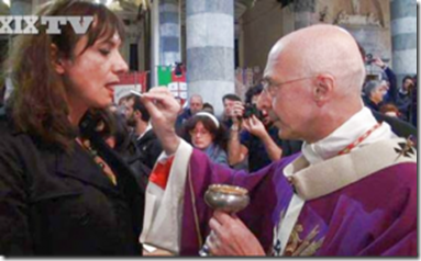 Cardinal Bagnasco, president of the Italian episcopal conference, distributing Holy Communion to the trans-sexual LGBT activist Vladimir Luxuria, at the funeral of the priest advocate of homosexuality, Don Gallo.